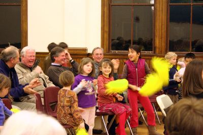 What's the Buzz?
The mini cheering section for the winning Seaside Sea Bees team goes wild at the Second Annual Lizzie Ts Spelling Bee to benefit Marions Elizabeth Taber Library as their team wins the event by correctly spelling "armagnac." Eleven teams of three members each competed in three rounds for the title of "Best Spellers." (Photo by Kenneth J. Souza).
