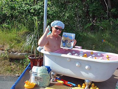 Bathtub Reading
Spence Smith from the South Coast Community Church of Marion enjoys his copy of The Wanderer while riding in the Marion Fourth of July Parade. The church based their unique float on the recent water bill crisis in town. (9/6/07 issue)
