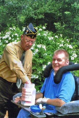 Spinal Cord Raffle
Michael Lamoureux, Commander of Florence Eastman American Legion Post 280, draws the names of winners in the Harbor Days Spinal Cord Society (SCS) raffle with Jamie Shepley, Vice President of the New Bedofrd/Fall River SCS chapter. Congratulations to the lucky winners and thanks to all who have supported the annual raffle for SCS, with 100 percent of the proceeds going to spinal cord injury research. (Photo courtesy of Jen Shepley).
