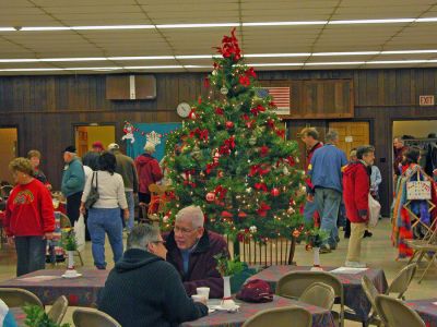 Harborside Christmas Fair 2006
Saint Anthonys Church in Mattapoisett kicked off the 2006 Holiday Village Stroll with their annual Harborside Christmas Fair. The church's Fellowship Hall was turned into a Christmas bazaar with booths selling everything from warm hand-knitted scarves to delicious baked goods. (Photo by Robert Chiarito). 
