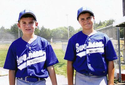 Mattapoisett Players Shine
Mitchell Midwood, left, and Cameron Coelho, both of Mattapoisett, are members this summer of the Swansea Tigers travel team of the Swansea Independent Baseball League. The Tigers recently captured the Massachusetts State Tournament championship of the Willie Mays Division (9- and 10-year-old players) of the American Amateur Baseball Congress and later placed third in the North Atlantic Regional Tournament held in Waldwick, N.J. (Photo courtesy of Swansea Independent Baseball League).
