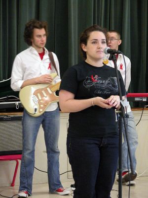 Swazi Aid Show
R&B singer Joy and her band performed during the first in a series of local benefit concerts at the Mattapoisett Congregational Church on Sunday, April 29. The show was organized by Mattapoisett resident and ORR graduate Sarah DeMatos (seen here introducing the group), who is attempting to raise money and awareness for abandoned children in Africa. (Photo by Robert Chiarito).
