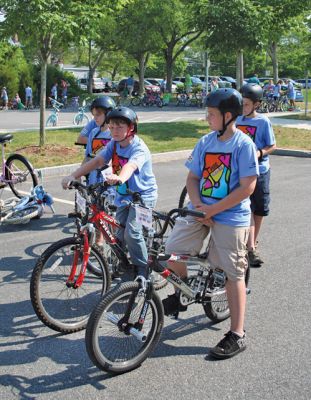 Tri-Town Bikers
The second annual Pan Mass Challenge (PMC) Tri-Town Ride for Kids was held on Saturday, June 14 in Mattapoisett with bikers of all ages rolling across the finish line at Center School. Proceeds from the Tri-Town Ride will benefit the Pan-Mass Challenge, which supports cancer research and treatment at Dana-Farber Cancer Institute through its Jimmy Fund. (Photo by Robert Chiarito).
