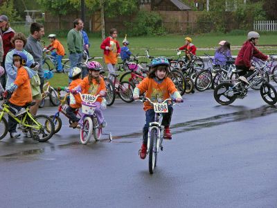 Tri-Town Bike Benefit
Several hundred children and their parents braved soggy conditions to participate in the first annual Pan-Mass Challenge (PMC) Tri-Town Ride for Kids on Saturday, May 19 starting at Center School on Barstow Street in Mattapoisett. The young bikers arrived with the goal of pedaling their way towards raising $10,000 in the fight to find a cure for cancer. Children ranging in age from 3 to 15 years were encouraged to participate in the bike rally benefit. (Photo by Robert Chiarito).
