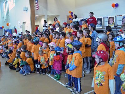 Tri-Town Bike Benefit
Several hundred children and their parents braved soggy conditions to participate in the first annual Pan-Mass Challenge (PMC) Tri-Town Ride for Kids on Saturday, May 19 starting at Center School on Barstow Street in Mattapoisett. The young bikers arrived with the goal of pedaling their way towards raising $10,000 in the fight to find a cure for cancer. Children ranging in age from 3 to 15 years were encouraged to participate in the bike rally benefit. (Photo by Robert Chiarito).
