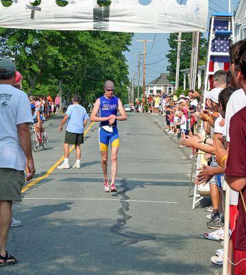 Triple Play
Brian Hughes (#1) of Randolph, MA once again took top overall honors in the 2007 Mattapoisett Lions Club Triathlon held on Sunday, July 15 with a final time of 51:30. (Photo by Robert Chiarito).
