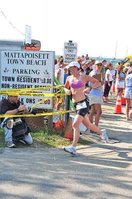 Triple Threat
Katherine McAdoo of Arlington, VA heads on to the next challenge in the 2008 Mattapoisett Lions Club Triathlon on Sunday, July 13. She would ultimately finish 26th overall and first in her age group. (Photo by Robert Chiarito).
