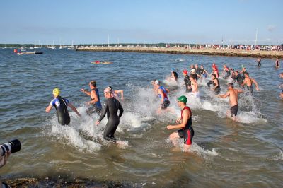 Triple Threat
The 2008 running of the Mattapoisett Lions Club Triathlon was held at the Mattapoisett Town Beach on Sunday morning, July 13, beginning at 8:00 am. This year 173 participants attempted the triple event which began with a swim in Mattapoisett Harbor, a bike ride into the town village, and a marathon back to the Town Beach. (Photo by Robert Chiarito).
