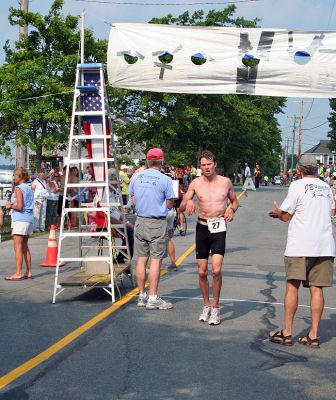 Triple Challenge
Gregory Harrison (#27) of Somerville, MA finished second overall in the 2007 Mattapoisett Lions Club Triathlon held on Sunday, July 15 with a final time of 53:01. (Photo by Robert Chiarito).
