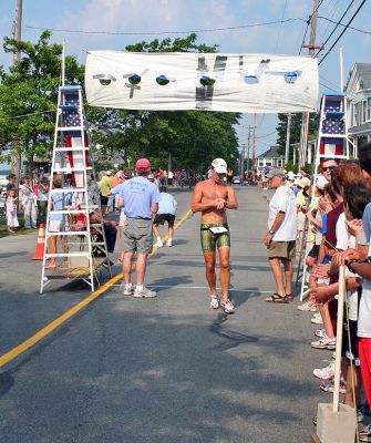 Triple Challenge
Paul Bedard, Jr. (#3) of Westport, MA finished third overall in the 2007 Mattapoisett Lions Club Triathlon held on Sunday, July 15 with a final time of 53:21. (Photo by Robert Chiarito).
