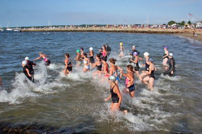 Triple Threat
The 2008 running of the Mattapoisett Lions Club Triathlon was held at the Mattapoisett Town Beach on Sunday morning, July 13, beginning at 8:00 am. This year 173 participants attempted the triple event which began with a swim in Mattapoisett Harbor, a bike ride into the town village, and a marathon back to the Town Beach. (Photo by Robert Chiarito).
