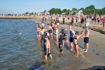 Triple Threat
The 2008 running of the Mattapoisett Lions Club Triathlon was held at the Mattapoisett Town Beach on Sunday morning, July 13, beginning at 8:00 am. This year 173 participants attempted the triple event which began with a swim in Mattapoisett Harbor, a bike ride into the town village, and a marathon back to the Town Beach. (Photo by Robert Chiarito).
