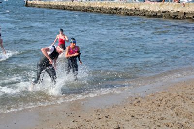 Triple Threat
The 2008 running of the Mattapoisett Lions Club Triathlon was held at the Mattapoisett Town Beach on Sunday morning, July 13, beginning at 8:00 am. This year 173 participants attempted the triple event which began with a swim in Mattapoisett Harbor, a bike ride into the town village, and a marathon back to the Town Beach. (Photo by Robert Chiarito).
