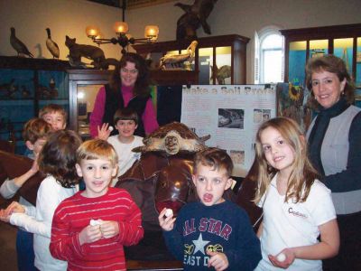 Talking Turtle
Pictures of Marion Natural History Museum's Sea Turtle program with Karen Dourdeville. During the program we talked about the life history of sea turtles and saw slides of the turtles that can be found in Buzzards Bay, and learned what we can do to help protect them.  We also examined the museum's preserved Hawksbill turtle, and the kids got their very own life sized turtle "egg" made of dough to make into their own baby turtle. (Photos courtesy of the Marion Natural History Museum.)
