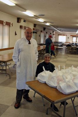 Marion Take-Out
Members of the Benjamin D. Cushing Post 2425 Veterans of Foreign Wars, Marion prepared Texas Style Chicken Barbeque take out dinners on Sunday April 5 at the Post's Pavillion on Route Six. The dinners gave residents the chance to sample a hearty helping of Chef Ron Barros' special BBQ sauce recipe with all of the trimming for a $10.00 donation. (Photo by Robert Chiarito)
