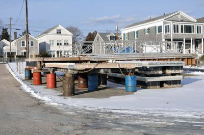 Winter of Discontent
Docks and floats from the Mattapoisett Town Beach and Wharf stacked and stored for winter. (Photo by Tim Smith).
