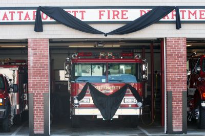 Paul Kelley
Hearts were heavy in Mattapoisett on August 18, 2011, as the town prepared to remember the life of a long-time resident and firefighter. Paul Kelley, 76, passed away on Sunday, August 14, 2011, after a battle with cancer. In front of the Mattapoisett fire station, Mr. Kelley's longtime Engine 1 was draped in black, a solemn nod to the man who served as its Captain for 16 years. Photo by Anne Kakley.
