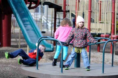 Playground Fun
Seven-year-old Cameron Allen, five-year-old Olivia Gianelis and five-year-old Jillian Allen take a spin at the Sippican School playground on January 8, 2012. Photo by Felix Perez.
