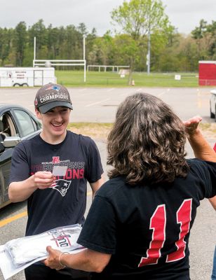 Class of 2020 
Graduating seniors in the Old Rochester Regional High School Class of 2020 drove around to the back of the school building on May 28, where they were greeted by faculty and administration. After arriving in order of homeroom to ensure safe spacing, the seniors turned in textbooks and received yearbooks, a surprise COVID-19 gift bag, and a long-sleeve t-shirt decorated with the mascot Bulldog and the word ‘Quarantine’ spelled across the front. Photo by Ryan Feeney
