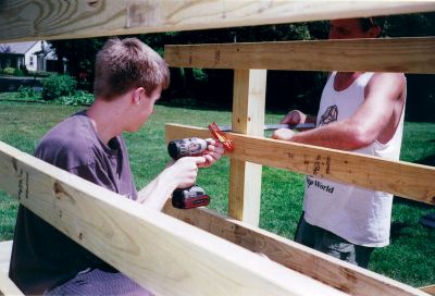 MLT Bridge
Bryan Buckley and his father Matthew work on the bridge that was installed on a Mattapoisett Land Trust trail as part of Bryans Eagle Scout project. Photo by Andrea Buckley.
