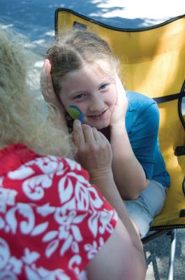Block Party!
It was a little earlier than usual, but the annual Marion Block Party on August 28, 2010 went off without a hitch. Children enjoyed cotton candy, a bounce house and face-painting, while the grown-ups enjoyed conversation and good weather. It was an appropriate send-off to summer, before Old Rochester schools started back up on September 1. Photo by Felix Perez.
