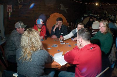 Texas Hold em
Ed Martin III checks his cards and considers a move at the Chloe Harding Fund Texas Hold em Tournament on March 5, 2011. Sixty-four players came out to support Chloe. Mr. Martin finished in fourth place. Photo by Felix Perez.

