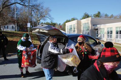 Fill-A-Cruiser Toy Drive
Sunday’s Fill-A-Cruiser toy drive at Sippican Elementary School was a success! Volunteers representing the Marion Police Department, Police Brotherhood, and Sippican School (VASE) welcomed a parade of vehicles of families dropping off a variety of Christmas gifts for cookies and cupcakes. Marion Police Chief John Garcia donned the Santa suit and took pictures with kids in school resource officer Matt McGraw’s 1924 Ford Model-T. Photos by Mick Colageo
