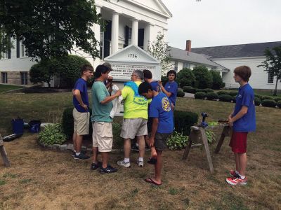 Boy Scout Troop 53
James DeMailly, a Mattapoisett resident with Boy Scout Troop 53, works along with fellow troop members to complete his Eagle project on Saturday, August 13. DeMailly repaired, restored, and coordinated the re-installation of the Mattapoisett Congregational Church sign with troop assistance. DeMailly said the scope of work took several months, as refurbishment was fairly extensive. The church funded the project. Photo by Marilou Newell
