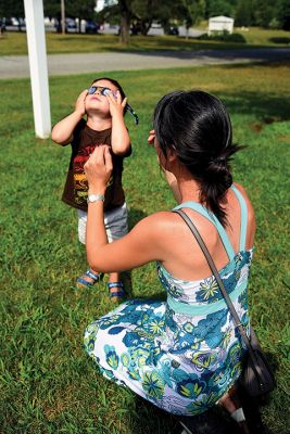 Partial Eclipse, Total Excitement 
The Plumb Library welcomed celestial spectators on Monday for the region’s partial eclipse of the sun, handing out free eclipse glasses. Photos by Glenn C. Silva
