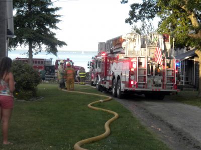 Bay Road Fire
The Mattapoisett Fire Department responded to a house fire on Bay Road at Point Connett around 7pm on Thursday July 22, 2010. The front of the structure was heavily damaged but the Fire Department was able to quickly contain the fire and keep it from spreading to neighboring homes. Photo by Paul Lopes
