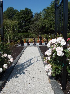 Gardens by the Sea
 This larger than life-sized chessboard surrounded by roses is just one of the unique gardens featured in St. Gabriel’s Church and the Garden Club of Marion’s garden tour titled, “Gardens by the Sea” on Friday, July 11th. This garden belonging to one Garden Club member was inspired by J.K. Rowling’s Harry Potter series. Photo by Jacqueline Hatch. 
