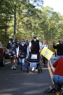 Brad Hathaway
It took 32 years, but on October 3 Mattapoisett resident Brad Hathaway completed his “Walk around the World” along Aucoot Road, accompanied by well over 100 friends and supporters of his mission refocused some years ago from what had begun as a fitness prescription to a fundraising effort for the Mattapoisett Land Trust. Hathaway, 88, is a co-founder of the MLT and has dedicated his life toward preserving and protecting lands that his ancestors first came upon hundreds of years ago. 
