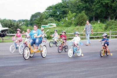 Heritage Days 2011
Children festooned their bicycles and enjoyed a ride around the village as a part of the 2011 Mattapoisett Heritage Days on August 6. Other Saturday activities included guided village tours, an evening concert and a treasure hunt. Mattapoisett bustled with activities on Saturday, but the bonfire was canceled due to wind, and many Heritage Days activities were canceled on Sunday due to heavy rain. Photos by Felix Perez.
