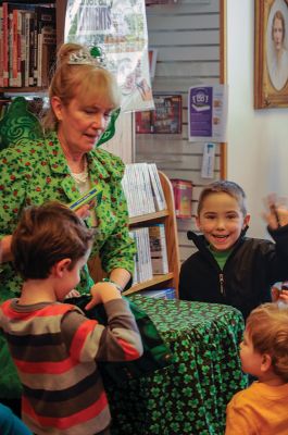 Irish Fairy Godmother
Bringing with her a magical teapot, the Irish Fairy Godmother visited the Joseph H. Plumb Memorial Library March 7, treating about 25 kids to a magic show. Magician Debbie O’Carroll said her favorite part about being the Irish Fairy Godmother is seeing the cheerful responses from her young audience. Photos by Felix Perez
