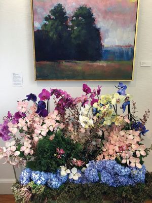 Art in Bloom Show
The Marion Art Center’s Art in Bloom Show opened on June 24. This year’s highlighted artist is the late Willoughby Elliott, whose landscapes and still lives were the inspiration for many exciting and uniquely realized floral arrangements. MAC members Kim Barry, Nicole Arsenault, Suzie Kokkins, Donna Paulding, Vicki Hurcombe, Joan Gardner, Michelle Russell, Karilon Grainger, Bunny Mogilnicki, Connie Dolan, Heather Parsons, Veronique Bale, Lisa Larkin, Ashley Briggs, and Virginia Boone displayed their creativ
