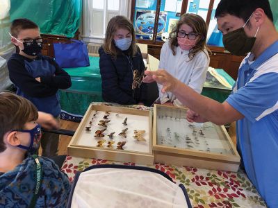 Marion Natural History Museum
The Marion Natural History Museum afterschool group had a wonderful time learning about “Amazing Arthropods” with entomologist Blake Dinius of Plymouth County Extension Service. Members of the group were able to handle a couple of beautiful Io moths, which as caterpillars feed on maple leaves. The adult moths emerge with no mouths and only live in this stage for one to two weeks.  Photos courtesy Elizabeth Leidhold
