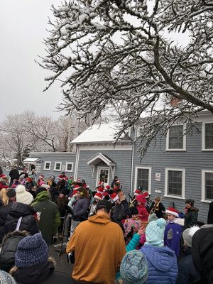 Marion Village Christmas Stroll
The Marion Village Christmas Stroll was this past cold and snowy Sunday. Santa and Ms. Clause arrived by their usual boat, though the cold and the wind sure made it look difficult to dock. Excited kids hurled snowballs all around (and at each other) as they waited for St. Nick. Photo by Sam Bishop
