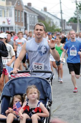 Mattapoisett Road Race
On Wednesday, July 4, over 1,000 runners braved the rain to participate in the Annual Mattapoisett Road Race.  All money raised from the 5-mile race will benefit graduating students from Old Rochester Regional High School.  Photo by Felix Perez.
