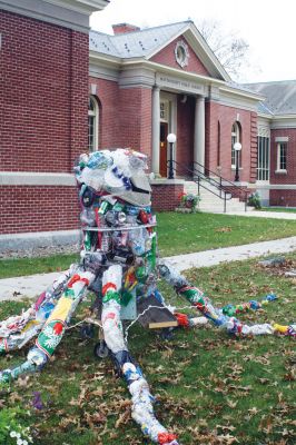 Ollie Around Town
With the help of Children's Librarian Liz Sherry, Mattapoisett children spent the summer constructing Ollie the Octopus out of recycled and repurposed materials. Lately Ollie has been seen enjoying the beautiful autumn wether on the front lawn of the library. Photo by Paul Lopes.
