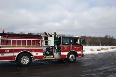 Santa Claus
Santa Claus and his elves swung by Ned’s Point, courtesy of the Mattapoisett Fire Department on Saturday morning. The Fire Department split up into Red and Green teams to cover neighbors in every corner of town as Santa waved to of families waiting along the roadside. Photos by Mick Colageo
