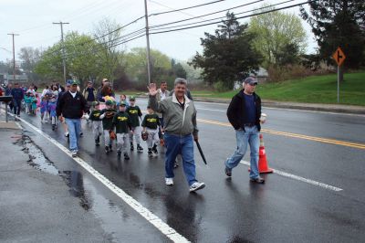 Opening Day
The Mattapoisett Youth Baseball League opened their 2009 season with a parade down Route Six on Saturday morning, May 2. Special guest and Boston Red Sox mascot Wally the Green Monster was on hand to throw out the first pitch and sign autographs for the young players. Photo by Robert Chiarito.
