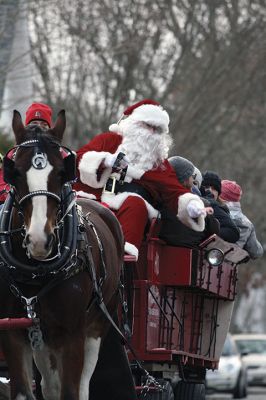 Marion Holiday Stroll
The Marion village streets were filled with holiday revelers on Sunday, December 9, for the annual Marion Holiday Stroll. Santa’s boat docked at the Marion Wharf where the faces of hundreds of children lit up at his arrival. Santa boarded a horse-drawn carriage and paraded through the streets, passing businesses offering free goodies and dodging the whereabouts of that old Grinch who didn’t seem to mind Christmas coming at all this year. Photos by Jean Perry
