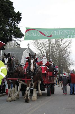 Marion Holiday Stroll
The Marion village streets were filled with holiday revelers on Sunday, December 9, for the annual Marion Holiday Stroll. Santa’s boat docked at the Marion Wharf where the faces of hundreds of children lit up at his arrival. Santa boarded a horse-drawn carriage and paraded through the streets, passing businesses offering free goodies and dodging the whereabouts of that old Grinch who didn’t seem to mind Christmas coming at all this year. Photos by Jean Perry
