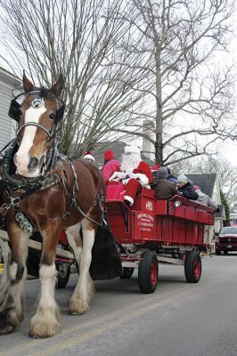 Marion Holiday Stroll
The Marion village streets were filled with holiday revelers on Sunday, December 9, for the annual Marion Holiday Stroll. Santa’s boat docked at the Marion Wharf where the faces of hundreds of children lit up at his arrival. Santa boarded a horse-drawn carriage and paraded through the streets, passing businesses offering free goodies and dodging the whereabouts of that old Grinch who didn’t seem to mind Christmas coming at all this year. Photos by Jean Perry
