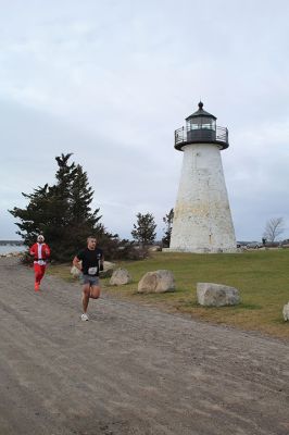 Mattapoisett Santa Stampede
The Mattapoisett Santa Stampede took place on Saturday, December 6 with over 300 Santas taking place. The 5K began at Shipyard Park and cut down Ned’s Point Road to the point, around the lighthouse and back. The Grinch led the pack on his bike, and residents stood by to cheer on all the runners. Photos by Sam Bishop and Mick Colageo
