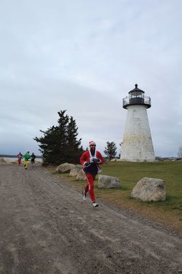 Mattapoisett Santa Stampede
The Mattapoisett Santa Stampede took place on Saturday, December 6 with over 300 Santas taking place. The 5K began at Shipyard Park and cut down Ned’s Point Road to the point, around the lighthouse and back. The Grinch led the pack on his bike, and residents stood by to cheer on all the runners. Photos by Sam Bishop and Mick Colageo
