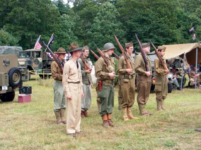 Rochester Country Fair
One of 26th Infantry Division Yankee Divisions World War II military vehicles that was on display at the Rochester Country Fair. The Infantry Division is a group of re-enactors that tours parades and fairs throughout the northeast. Above right: Young members of the 26th Infantry Division Yankee Division saluting a higher ranking official. Photos by Adam Silva.
