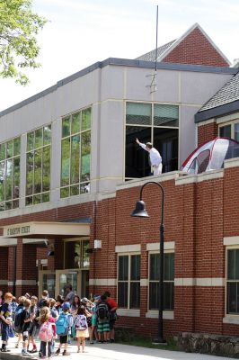 Mr. T!
Students chanted “Mr. T!” to Mr. Tavares on the roof as they left school June 18. Kevin Tavares, associate principal, challenged the kids to raise 481 canned goods to top Mr. T’s 480 – they collected over 800 instead! Mr. T had to spend the night on the roof of Center School, calling the community out to visit him and bring canned goods so he could match the students’ grand total. Photos by Jean Perry
