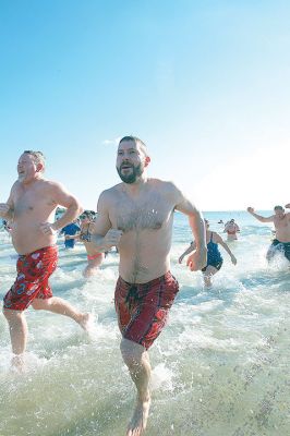 Freezin’ for a Reason Polar Plunge
It takes a certain type of person to jump into the cold ocean on New Year’s morning. Behold, the locals who fit that description as they enjoy a frosty January 1st at Mattapoisett Town Beach for the annual Freezin’ for a Reason Polar Plunge! Hundreds lined the beach to take the plunge, with bundled spectators watching from the sidelines and cheering as the plungers charged ahead screaming and shrieking with exhilaration. Proceeds from the plunge benefit locals battling cancer. Photos by Colin Veitch
