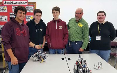 Old Colony “Vex team”
Old Colony “Vex team” engineering students visited Old Hammondtown School on October 24 and showed off some mad robotics skills. Jake Amadea, Tyler Blanchette, Jared Boren, Austin DeSousa, Chris Lambert, Isabella Mauradian, and Leandra Stroud-Jackson from Daniel Brush’s class showed OHS students how they built, programmed, and now operate their robots; something each of the OC engineering students is passionate about. Photos by Lisa Lourenco and E.O. Bednarczyk
